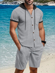 Grey short sleeve hooded button-down shirt with pocket and matching drawstring shorts.