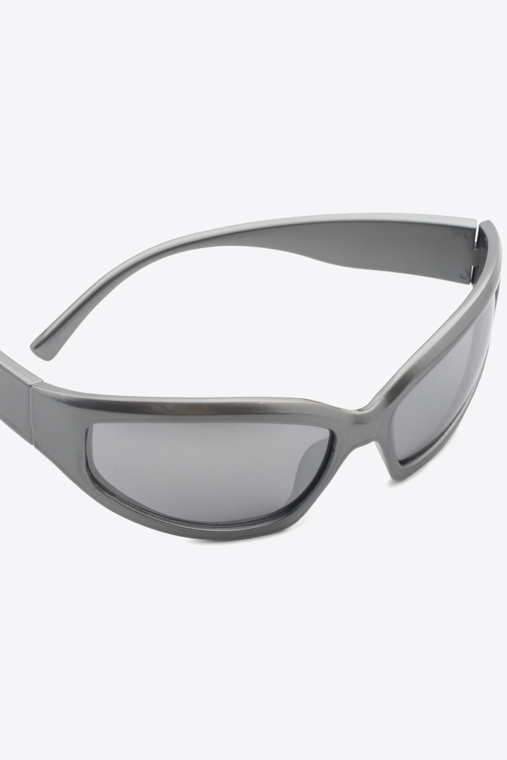Mid Gray sculpted shield sunglasses with a sleek, modern design.