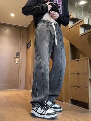 Dark gray vintage wash straight-leg jeans with drawstring waist and contrast stitching.