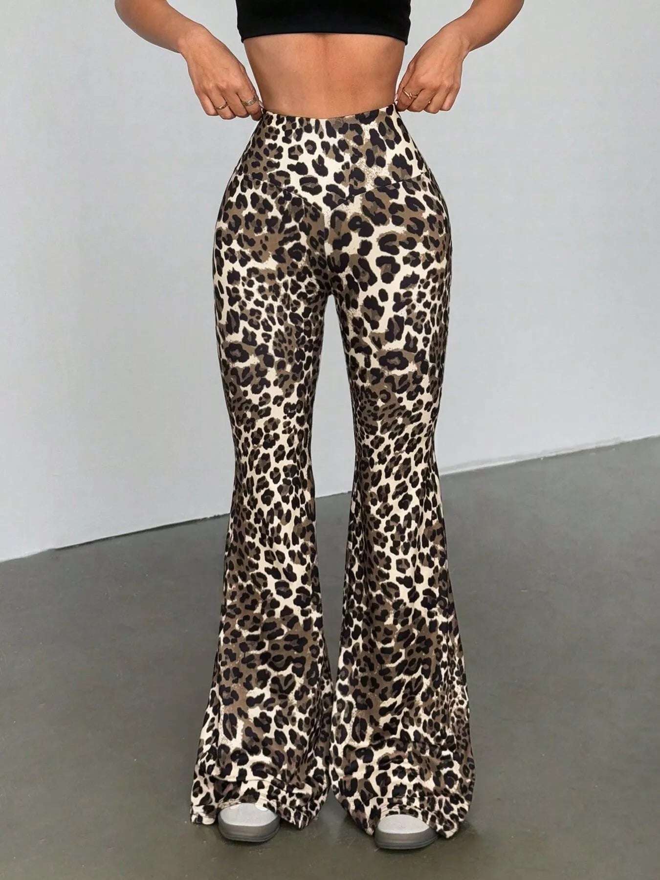 Leopard print high-waist flare pants in red, featuring a comfortable fit and a casual style.