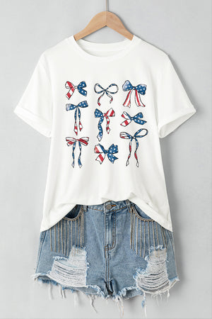 White t-shirt with a montage of patriotic bows in red, white, and blue flag print.