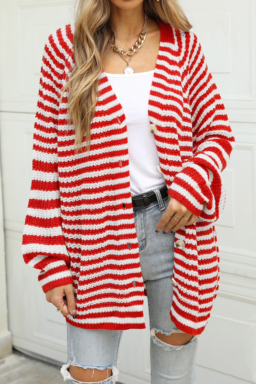 Bold stripe balloon sleeve cardigan in deep red and white acrylic with button front and distressed details.