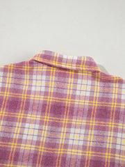 Oversized plaid shacket with classic collar in pink and yellow plaid pattern.