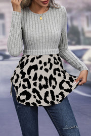 Ribbed knit grey peplum blouse with leopard print hem and crew neck.