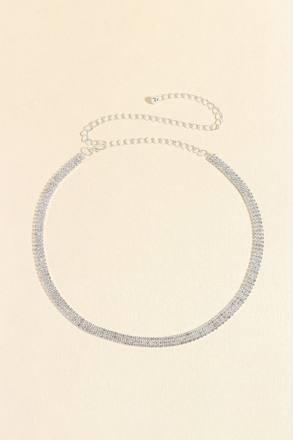 Triple-row crystal waist chain in silver with delicate chain extender.
