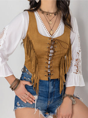 Tan suede fringe corset vest with lace-up front and boho styling.