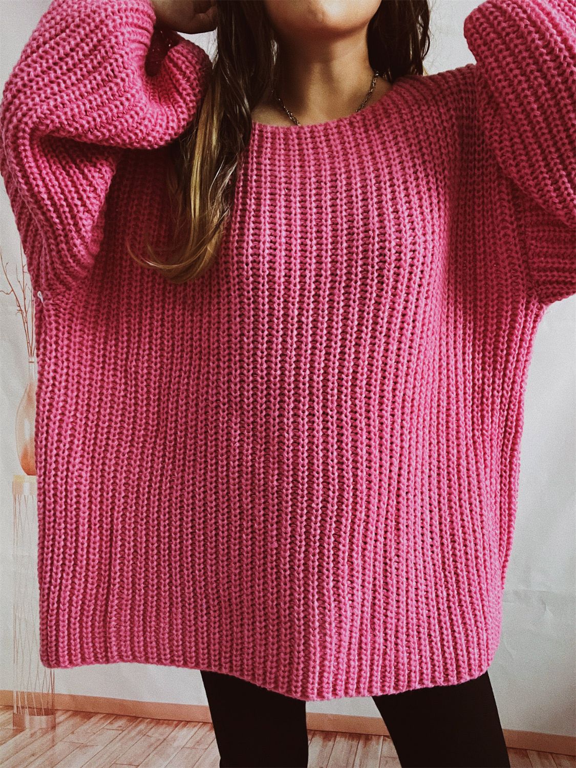 Hot Pink oversized ribbed knit sweater with crew neck and long sleeves.