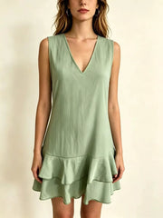 Light green sleeveless mini dress with tiered ruffles and V-neck.