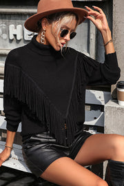 Black turtleneck sweater with chevron fringe detail and long sleeves.