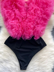 Ruffled V-neck bodysuit in black with a sheer pink tulle ruffle overlay.