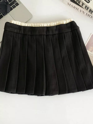 Black pleated skirt with drawstring waist and elastic band detail