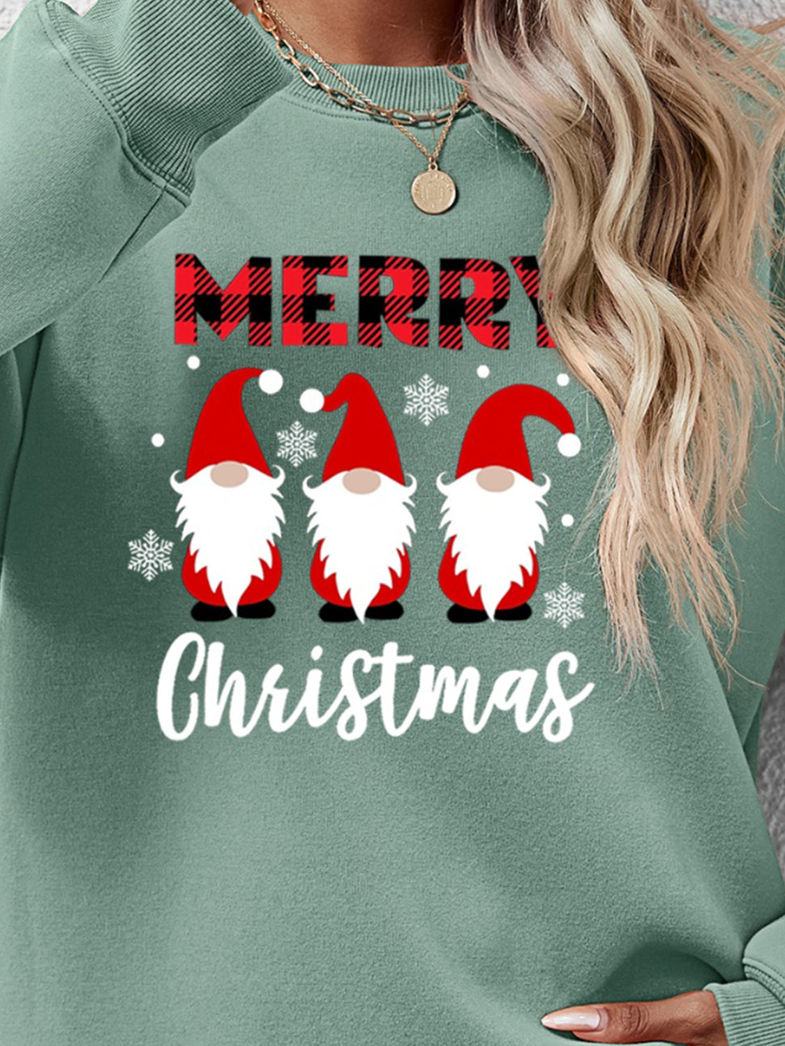 Sage Christmas gnome graphic sweatshirt with Merry Christmas text and snowflakes.