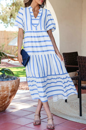 White and blue striped tiered midi dress with ricrac trim and puff sleeves.