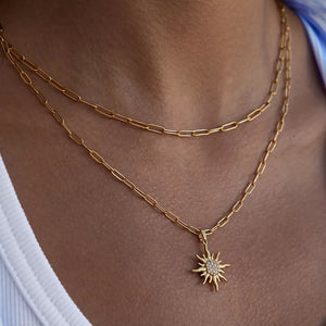 18k gold layered necklace with sun pendant and diamond accents