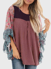 Textured panel blouse with floral print flutter sleeves in mauve and dusty blue.