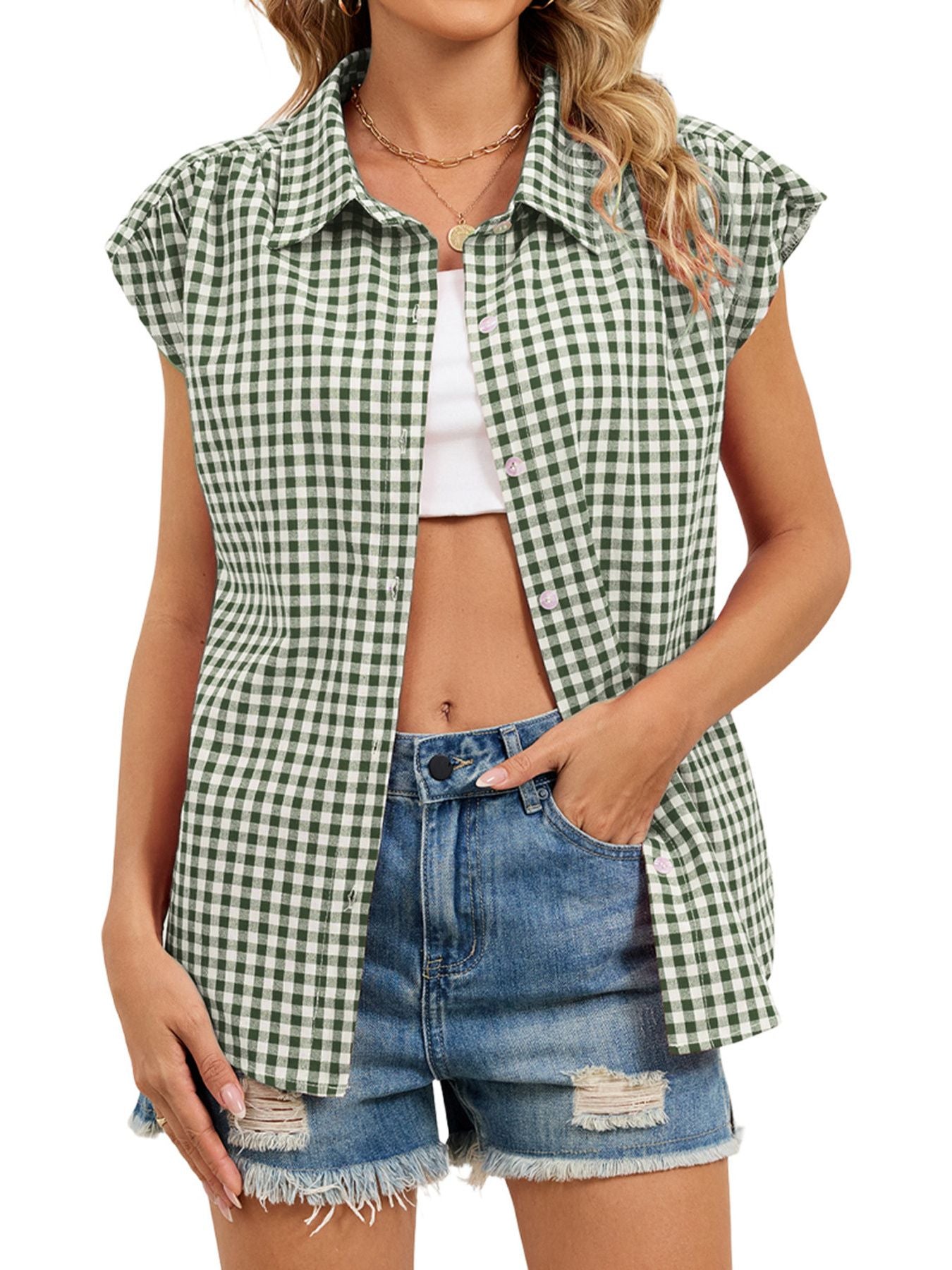 Green gingham cotton shirt with cap sleeves and button-down front, styled casually.