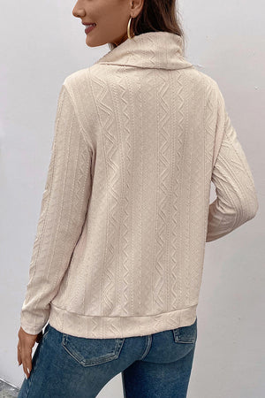 Beige textured cowl neck drawstring knit sweater with long sleeves.