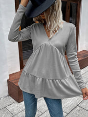 Light gray waffle knit peplum top with V-neck and long sleeves