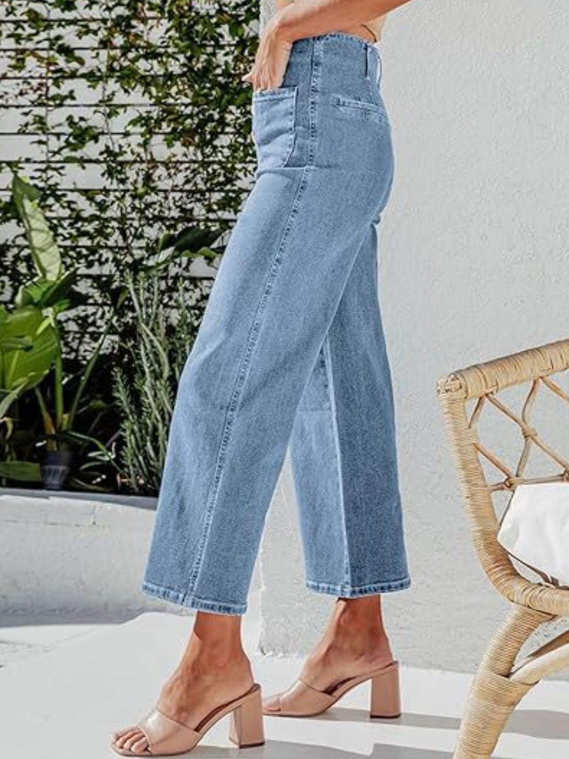 Button-front wide-leg cropped jeans in light blue denim with a casual fit.