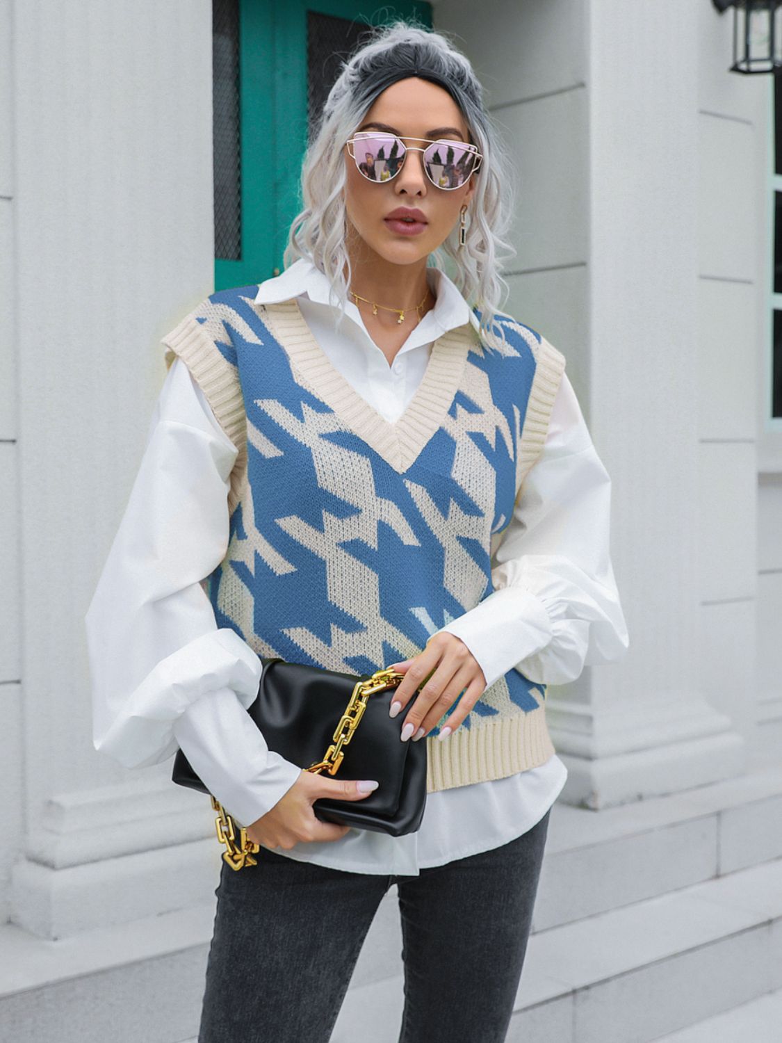 Houndstooth knit v-neck pullover vest in blue and beige acrylic, styled with a white shirt.