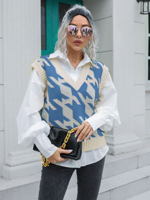 Houndstooth knit v-neck pullover vest in blue and beige acrylic, styled with a white shirt.