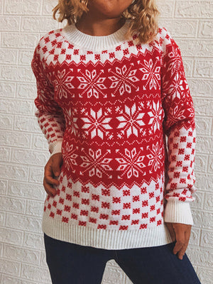 Red and white snowflake knit pullover sweater with crew neck and long sleeves.