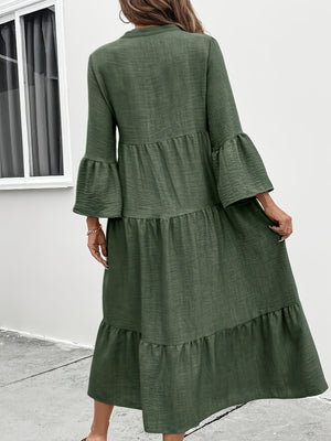 Tiered midi dress in olive green cotton blend with bell sleeves and button front.