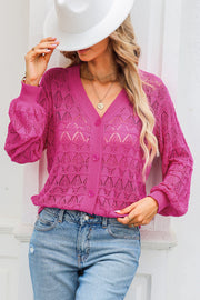 Deep Rose openwork knit cardigan with balloon sleeves and button front.