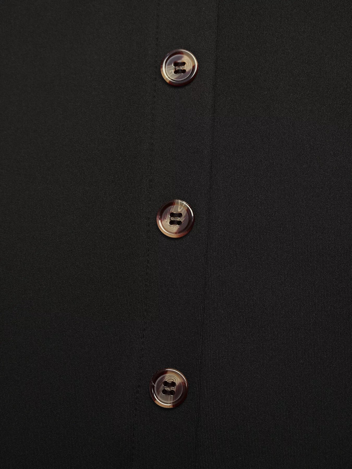 Black midi skirt with tortoise shell button front detail