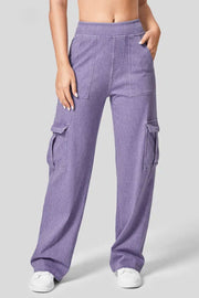 Lilac denim wide-leg cargo pants with front and side pockets.