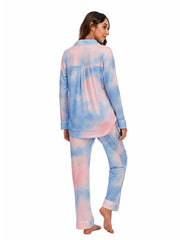 Pajama set with tie-dye pattern in pink and blue, piped trim, and button-up shirt.