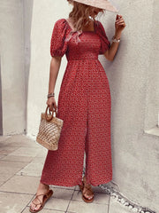 Red floral smocked bodice puff sleeve wide-leg jumpsuit with a square neckline and front slit.