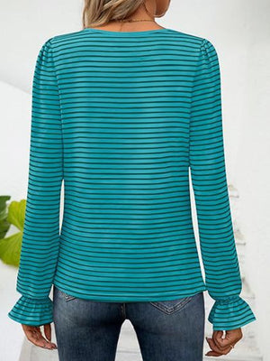 Teal striped blouse with ruffle cuffs and long sleeves.