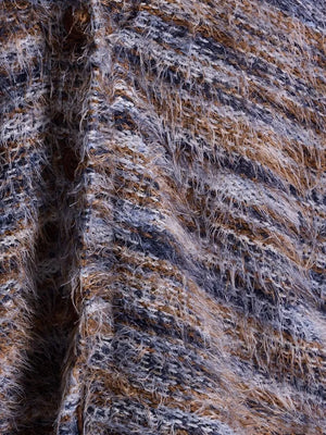 Cozy textured knit cardigan with fuzzy yarns in brown, blue, and gray stripes.