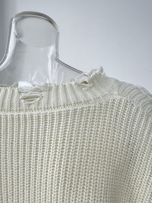 Off white distressed cotton sweater with deconstructed details and frayed neckline.