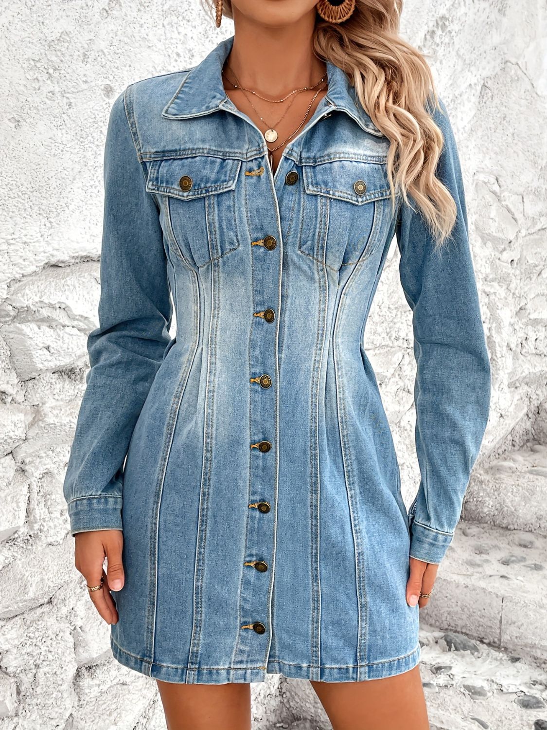Sculpted denim button-down mini dress in medium wash cotton with a flattering fit.