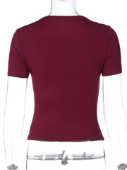 Wine red tie-front t-shirt with lace trim, short sleeves, and cropped fit.