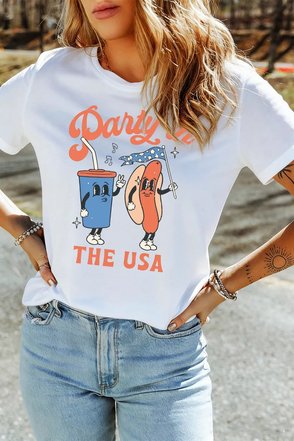 White polyester t-shirt with retro patriotic graphic of a hot dog and drink saying Party Like The USA