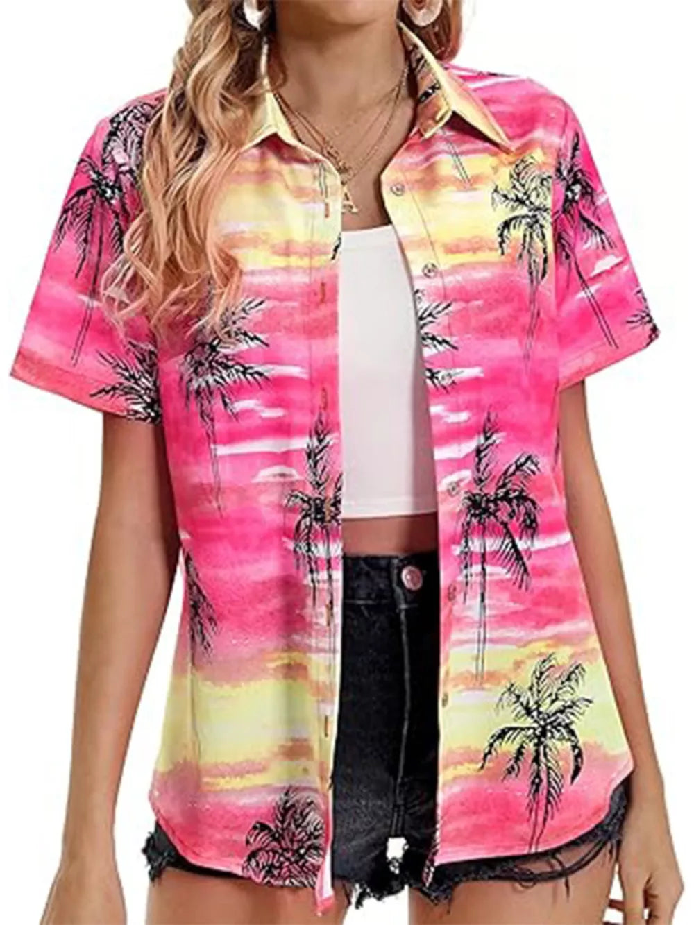 Tropical hibiscus print button-up shirt in pink and yellow with palm trees, short sleeves, and a collar.