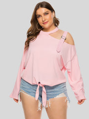 Blush pink cold shoulder blouse with cutout neckline, shoulder buckle detail, and tie front.