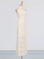 Textured halter neck maxi dress in ivory with a ruched bodice and tiered skirt.
