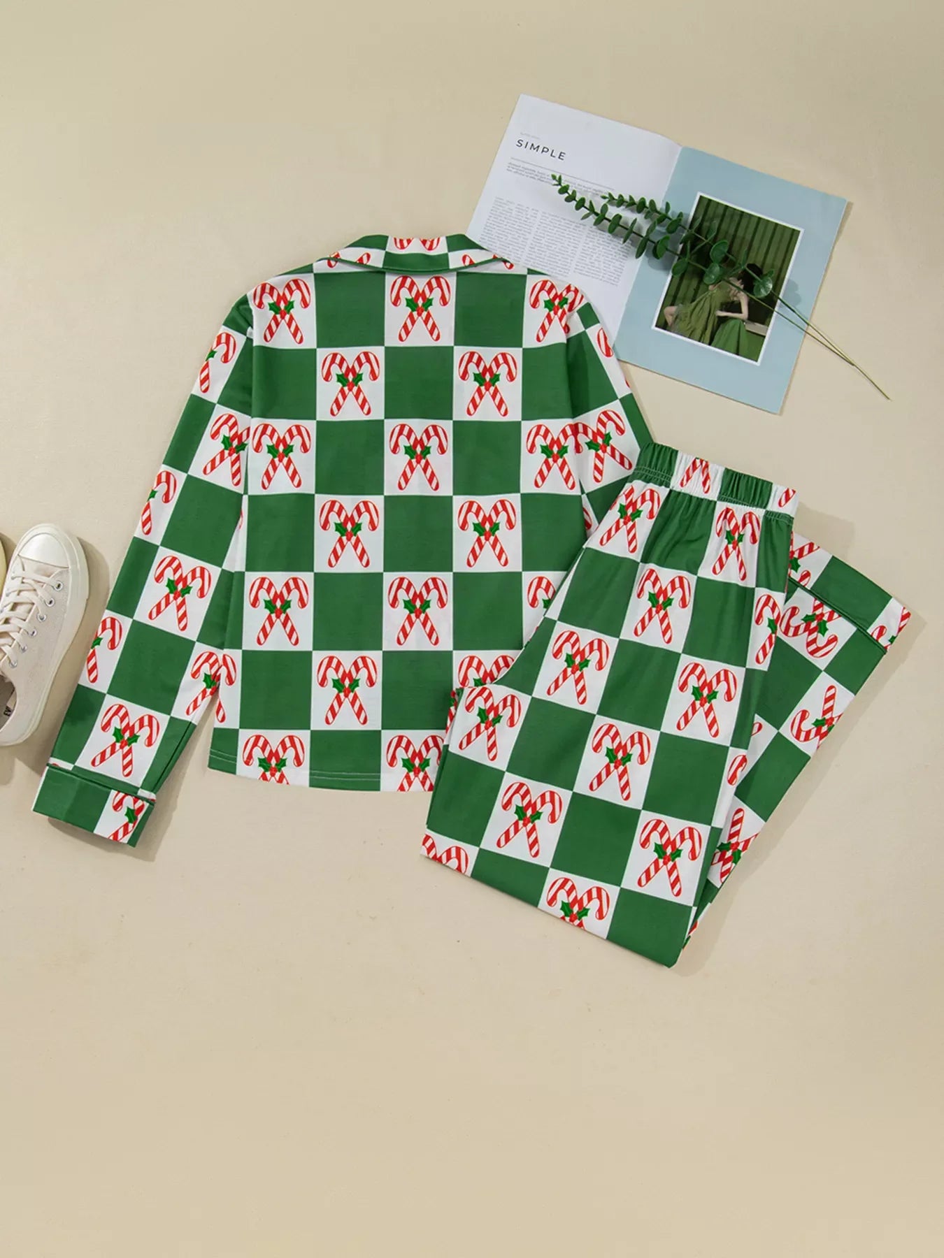 Green checkered pajama set with candy cane print, long sleeves, and pants.