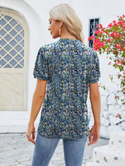 Floral print blouse in Peacock Blue with short sleeves and a keyhole neckline.