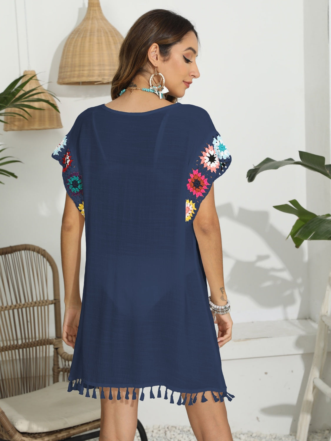 Dark blue tunic with crochet floral sleeves and tassel hem