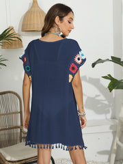 Dark blue tunic with crochet floral sleeves and tassel hem