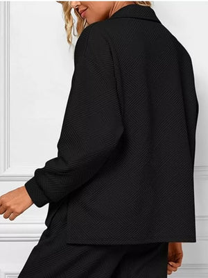 Black V-neck textured lounge set with diagonal pattern.