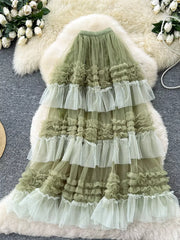 Green tiered tulle skirt with ruffles and a flowy silhouette.