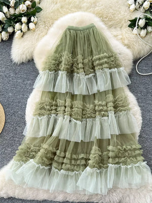 Green tiered tulle skirt with ruffles and a flowy silhouette.
