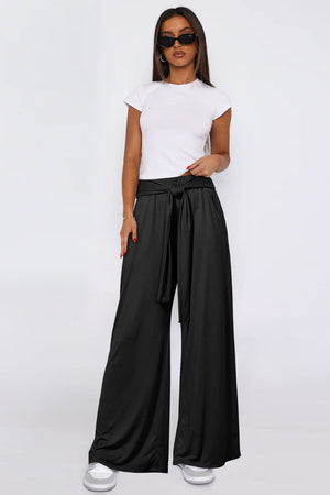 Black soft drape palazzo trousers with tie waist and wide leg