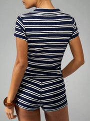 Chic striped knit two-piece set in navy and white, featuring a short sleeve top and shorts.